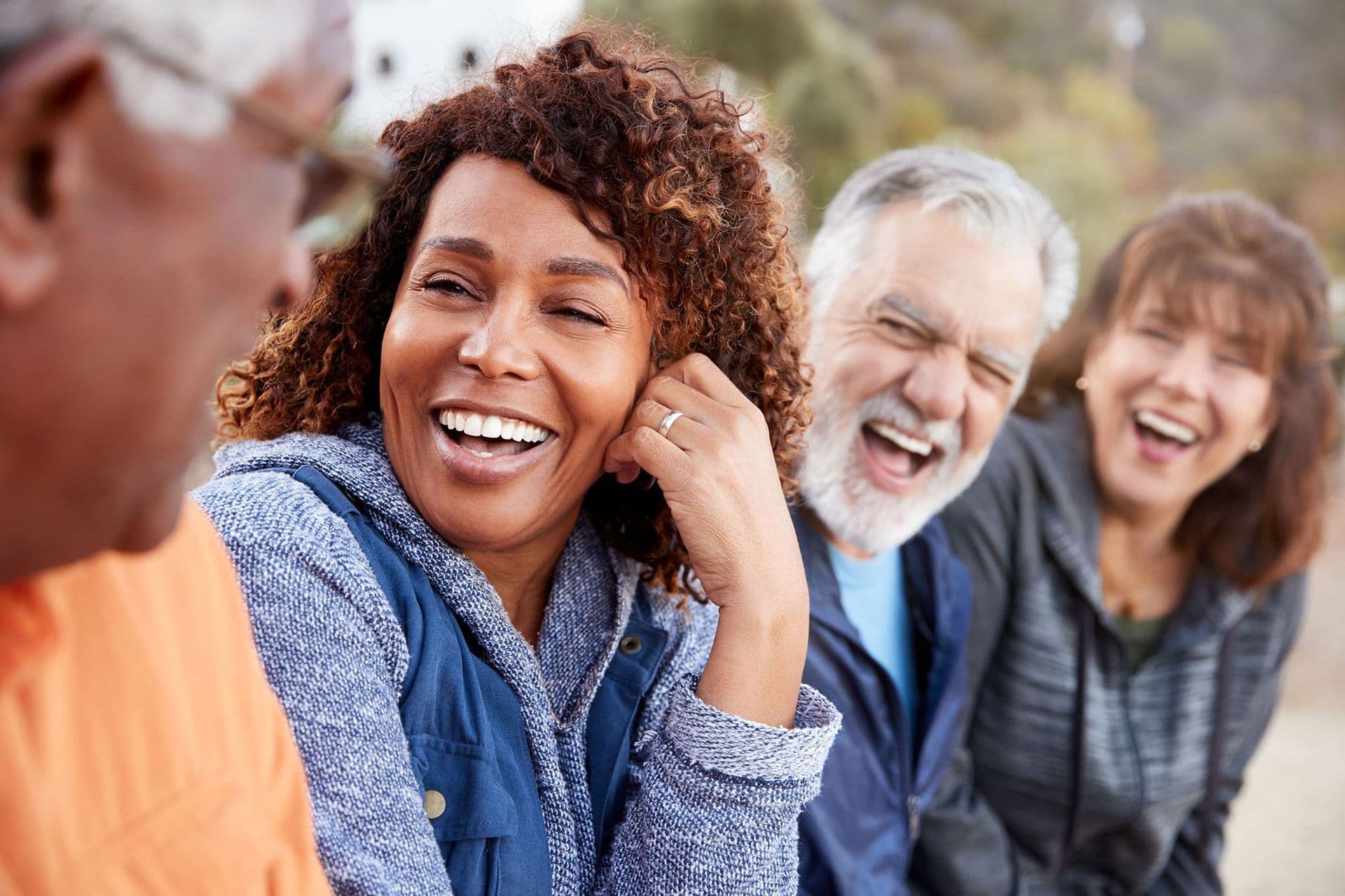Happy retired family group smiling together